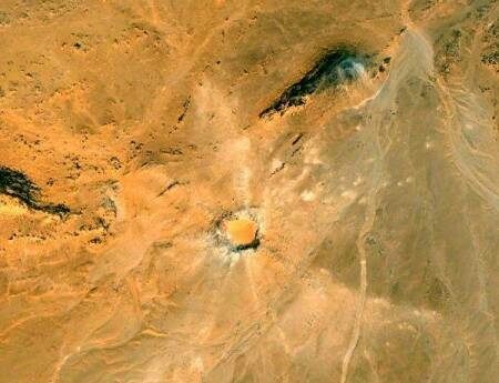 A satellite image of the Gebel Kamil impact crater.